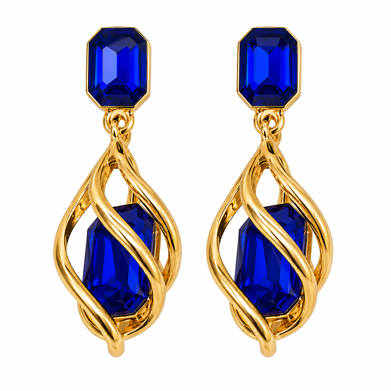 A pair of gold drop earrings with faceted royal blue gemstones, featuring a smaller rectangular blue stone at the top and a larger teardrop-shaped blue stone surrounded by twisted gold wire below, set against a plain white background.